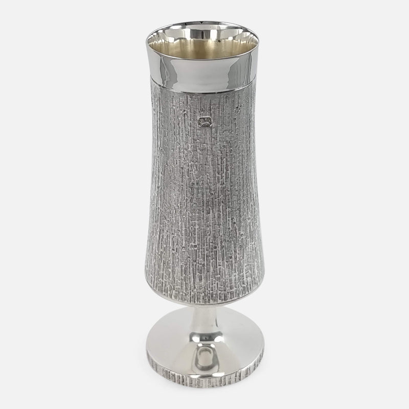 the sterling silver vase by CJ Vander, viewed from a slightly raised position
