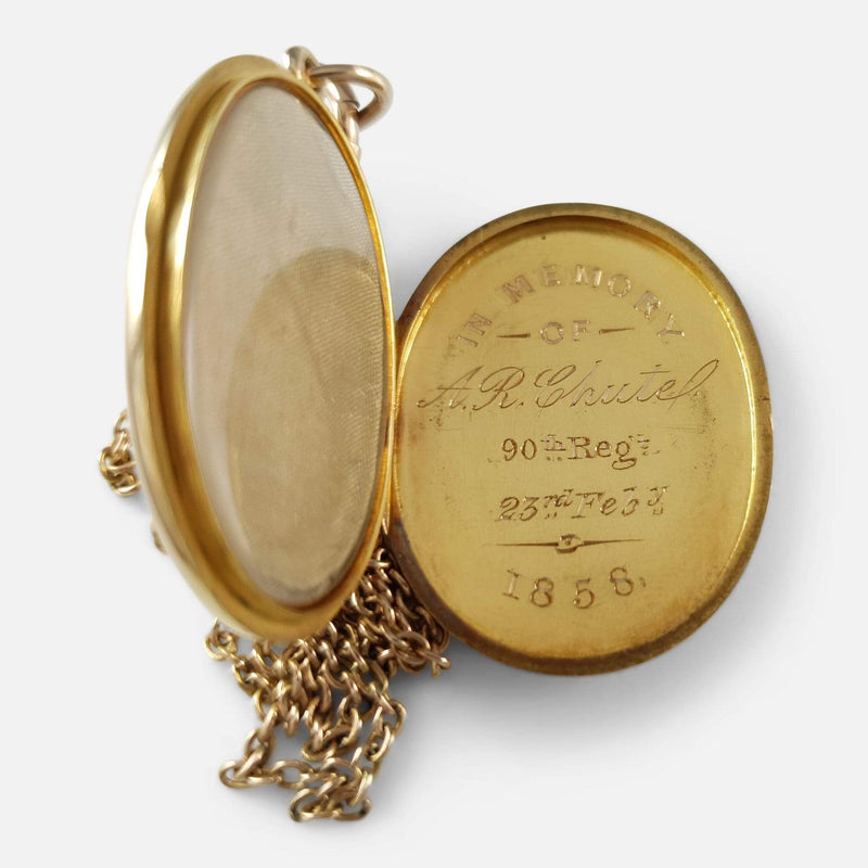 the locket opened to reveal the memorial inscription