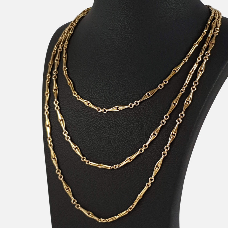 the 15ct Gold Fancy Link Muff Chain viewed on a bust