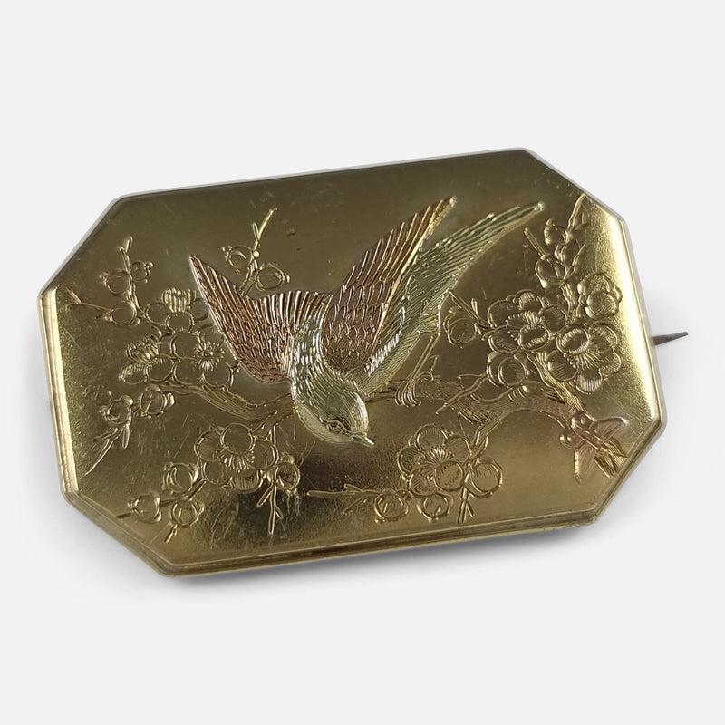 the Victorian 15 carat gold Aesthetic Movement plaque brooch, viewed at a slight angle