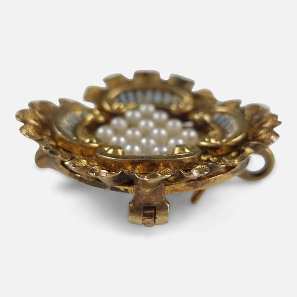 the brooch viewed side on