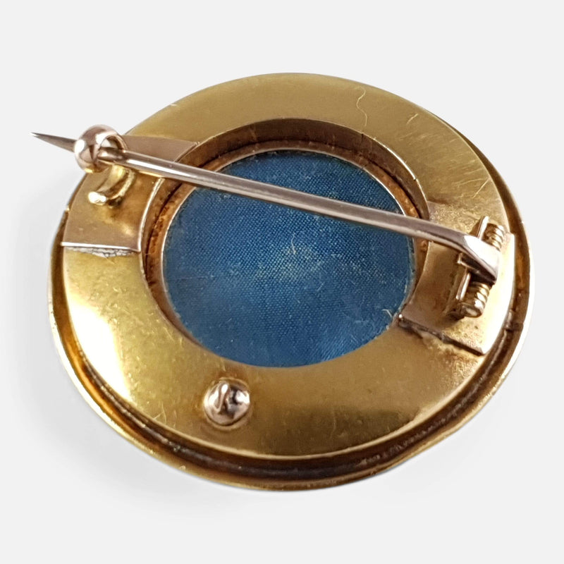 the back of the brooch with pin in focus