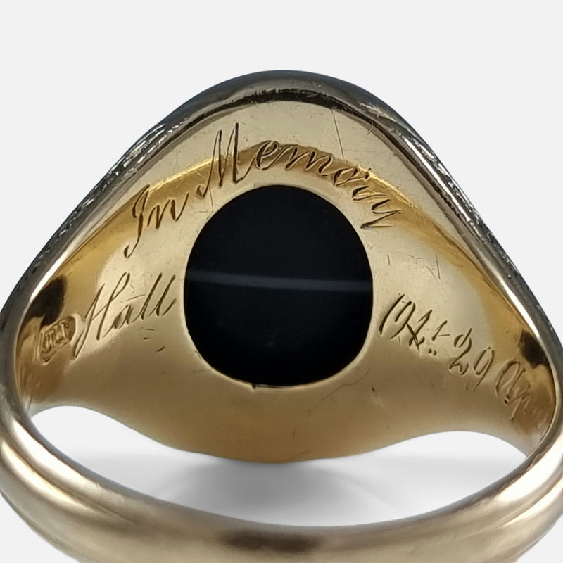 focused on a section of the inscription to the inside of the gold ring
