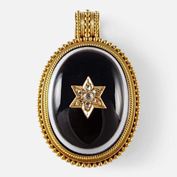 the Victorian 18ct gold diamond and bulls eye banded agate locket viewed from the front
