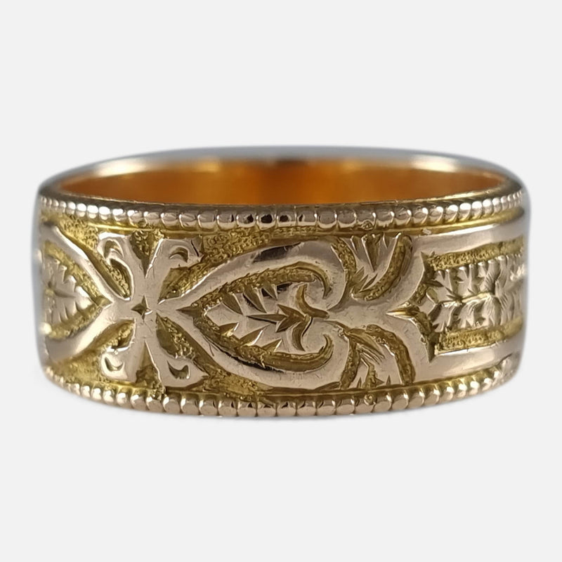 the ring with a section of the engraved decoration in focus