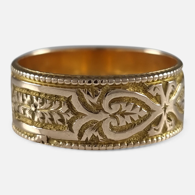 the ring with a section of the engraved decoration in focus