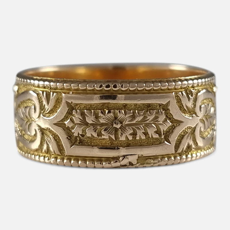 the ring with a section of the engraved decoration in focus