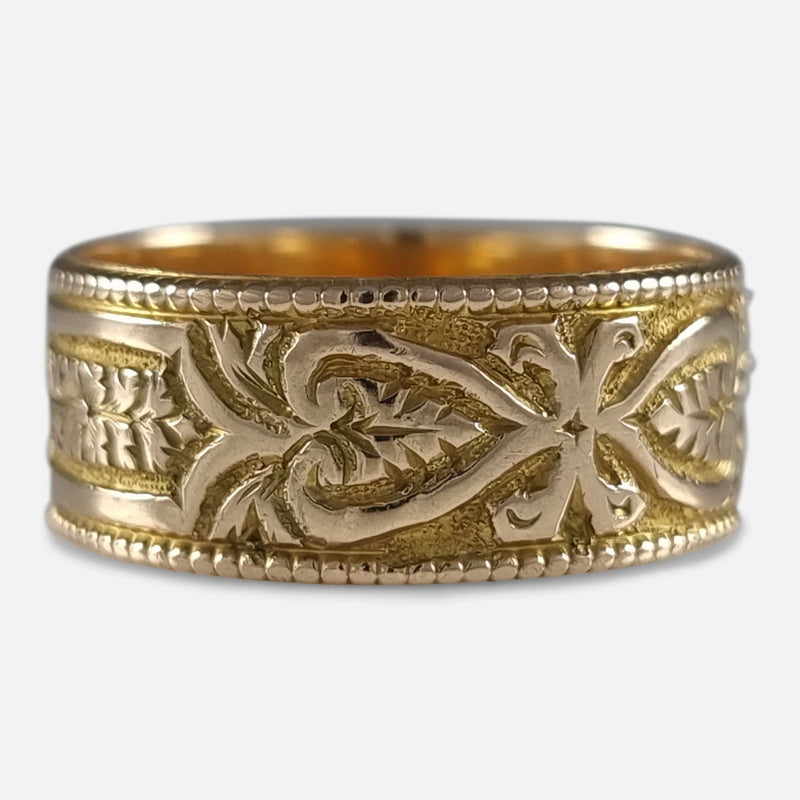 the ring with a section of the engraved decoration in focus