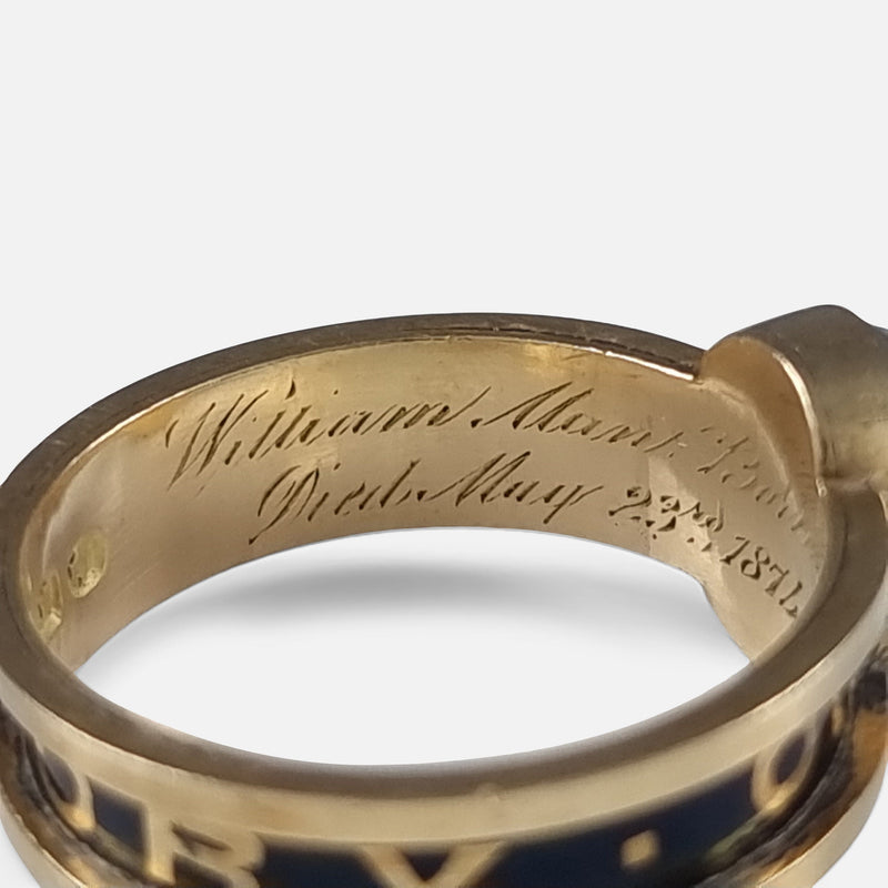 focused on a section of the inscription to the inside of the gold ring