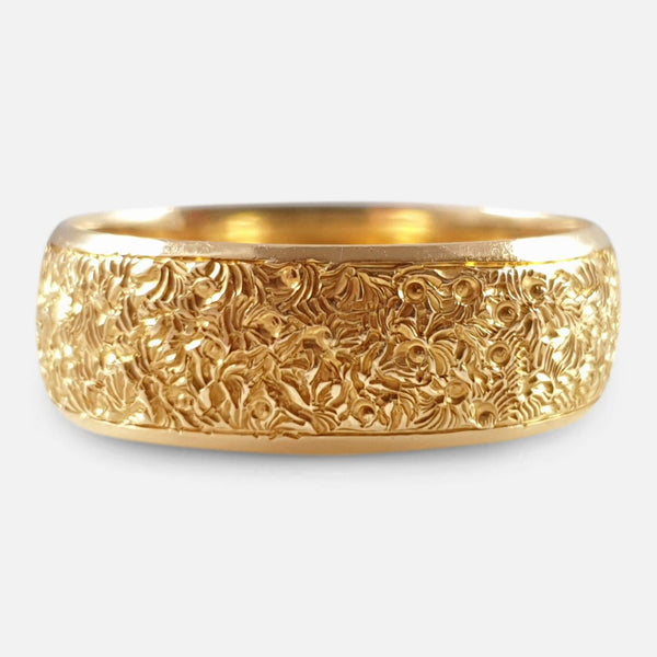 the Victorian 18ct gold engraved wedding band viewed from the front