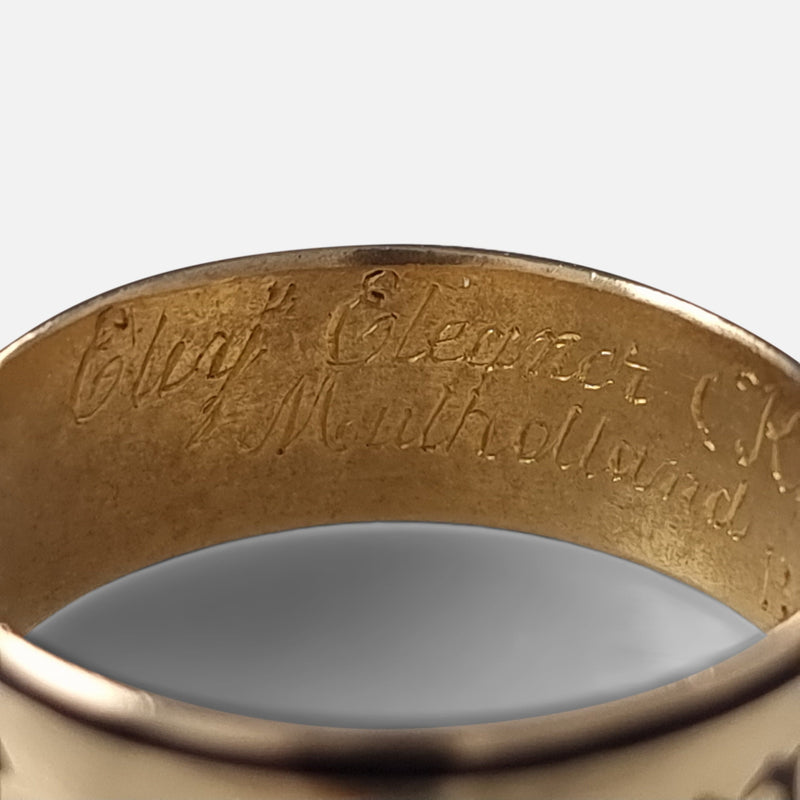 part of the engraved inscription to the interior of the ring in focus