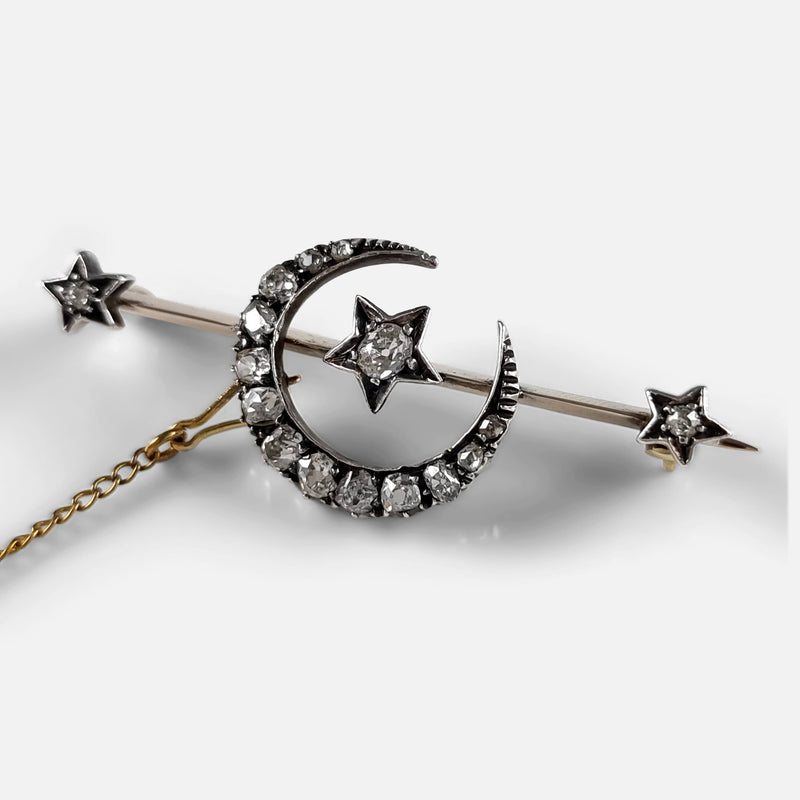 the diamond crescent brooch viewed at a slight angle