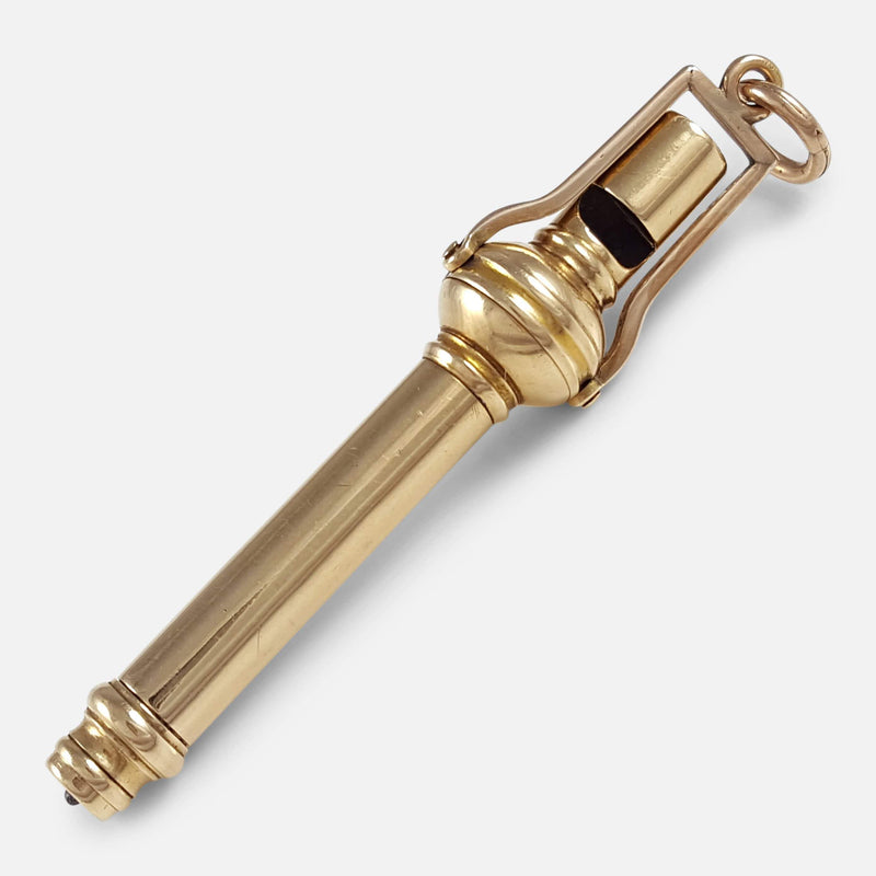 the propelling pencil and whistle lying diagonally