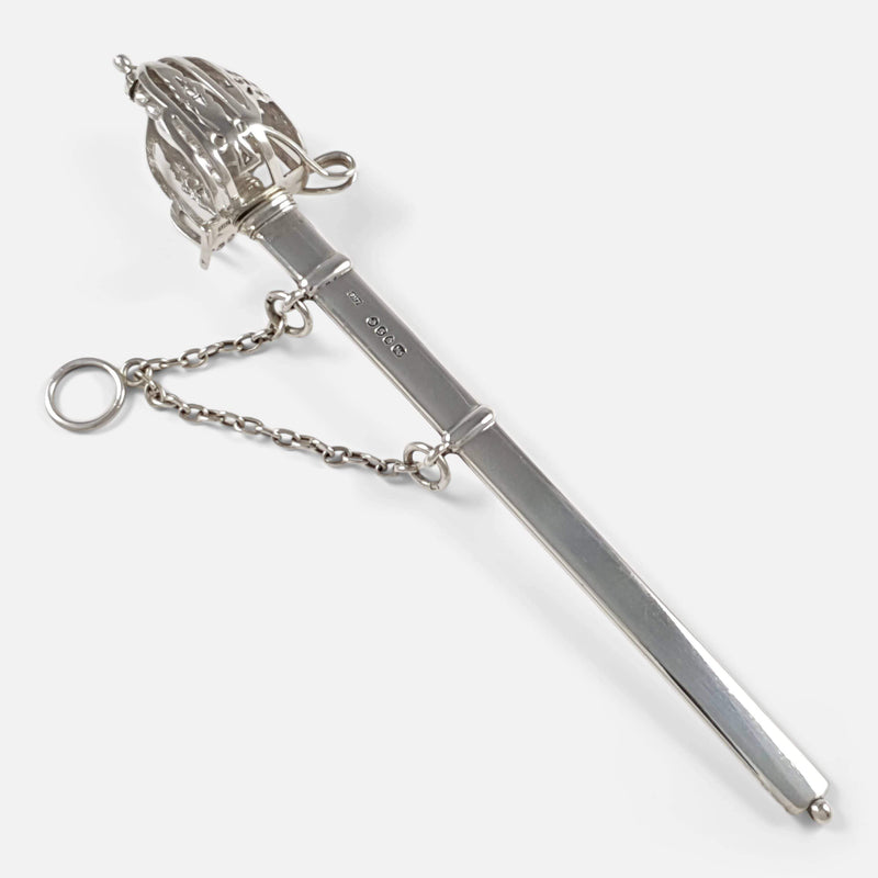 The antique silver letter opener in its scabbard