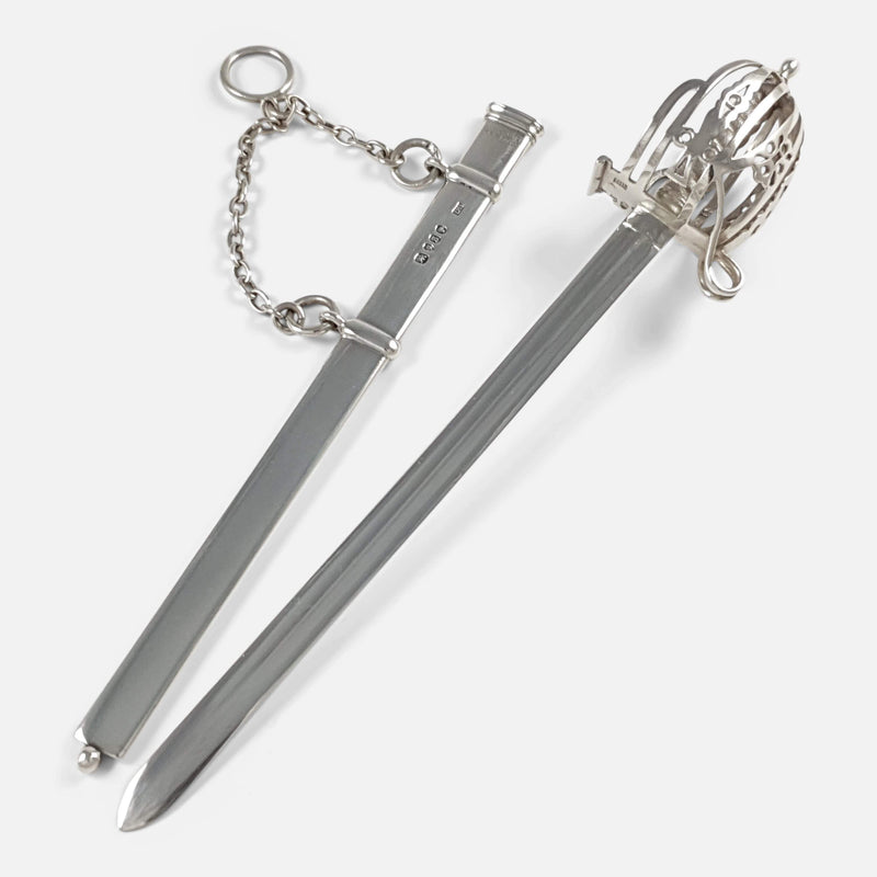 the basket hilted sword Letter opener and scabbard lying side by side