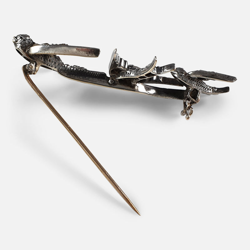 the brooch viewed with the pin unfastened