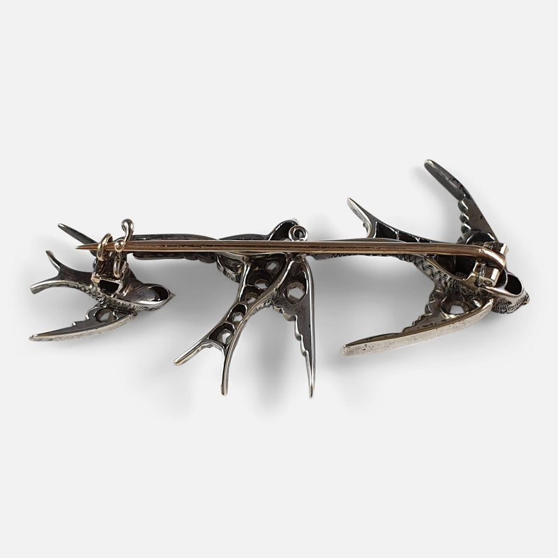 the back of the brooch with pin in focus