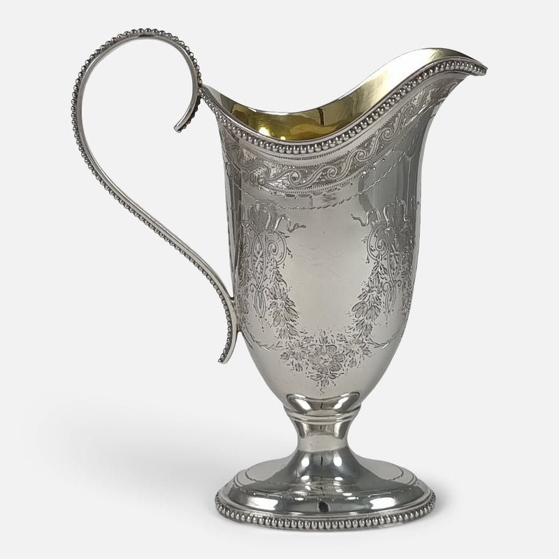 a side on view of the cream jug with spout facing towards the right side